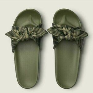 Pink slides army green in color with satin bows size small.